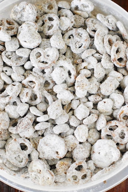Puppy Chow {or Yuppy Chow} ~ Covered in chocolaty goodness & powdered sugar, it's a classic sweet treat ... perfect for everyday snacking or Christmas gift giving.  Freezer-friendly, too, for make-ahead convenience.   www.thekitchenismyplayground.com