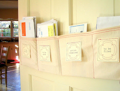 Create a diy mail sorter with this simple tutorial from bright and blithe blog. Made from unbleached cotton, this mail sorter can be hung on a neighboring door or wall. The tutorial includes printable labels for action required, to be paid, to be filed, and to be sorted.