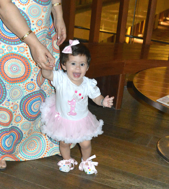 pink and white dress with bow clip