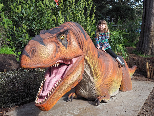 girl riding t-rex