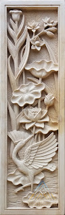 Relief bunga lotus dan burung bangau dibuat dari batu alam paras jogja atau batu putih