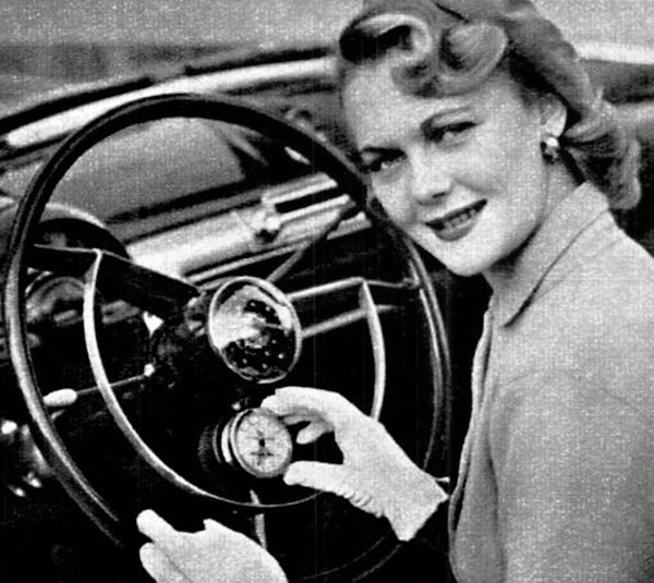 1951 Lady driving a Ford