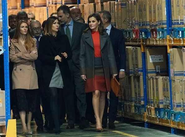 Queen Letizia wore Hugo Boss colorina wool blend cashmere striped coat and skirt and she wore Uterqüe pumps, Tous earings at Joma Sport