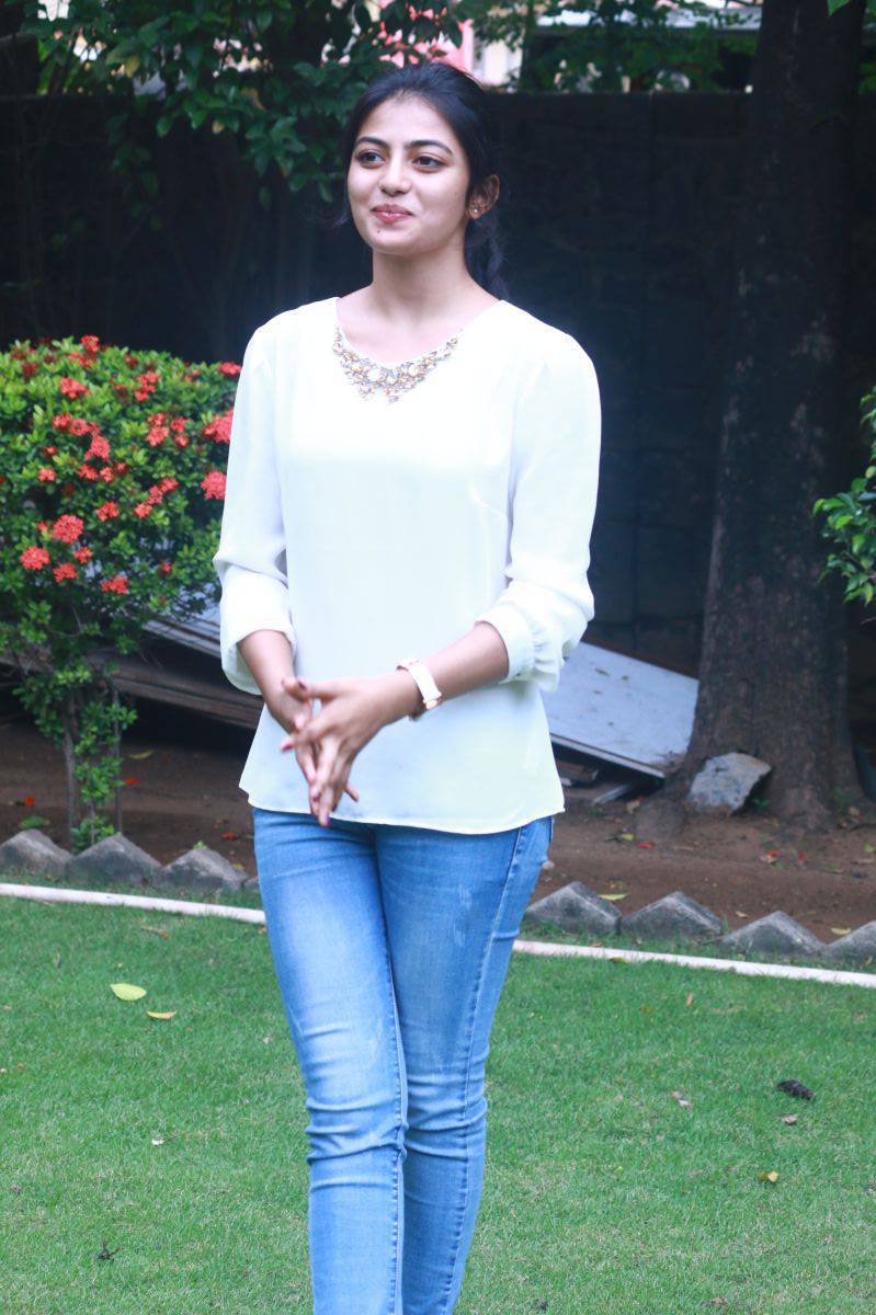 Actress Anandhi Latest Smiling Photos In White Top Blue Jeans