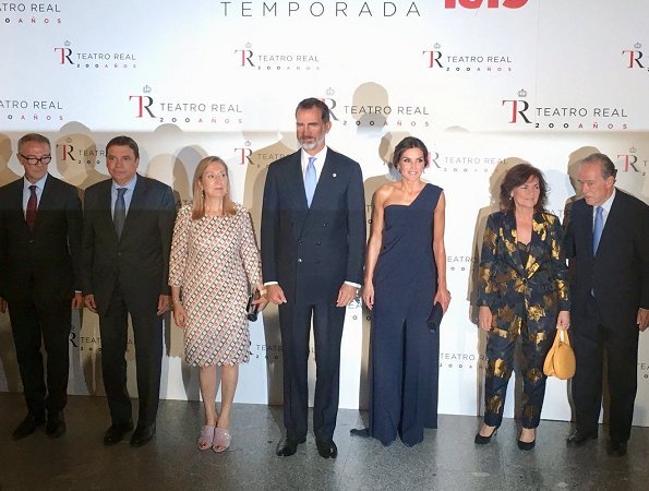 Queen Letizia wore Pedro del Hierro jumpsuit and Nina Ricci pumps, carried Felipe Varela clutch bag