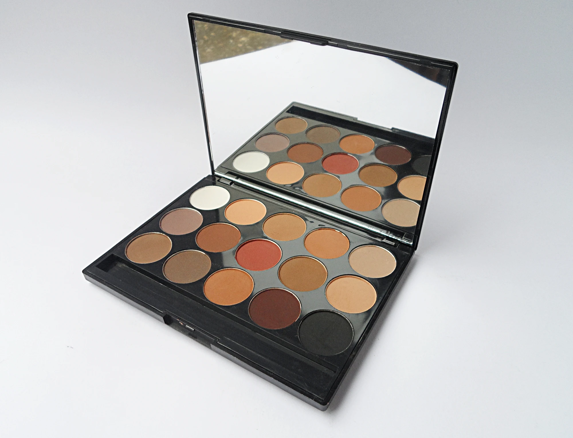 a studio picture of an eyesahdow palette on a plain background
