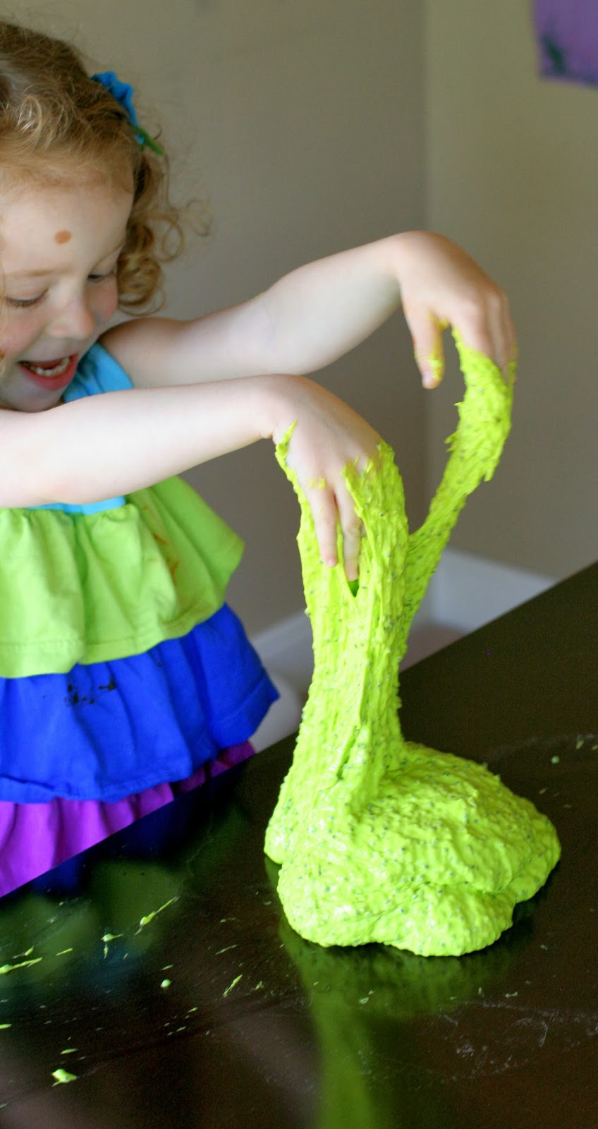 {New Recipe} All-Natural Edible Slime!  No cook recipe that's ready in less than 5 minutes.  Feels and acts just like traditional slimes without any chemicals!  From Fun at Home with Kids