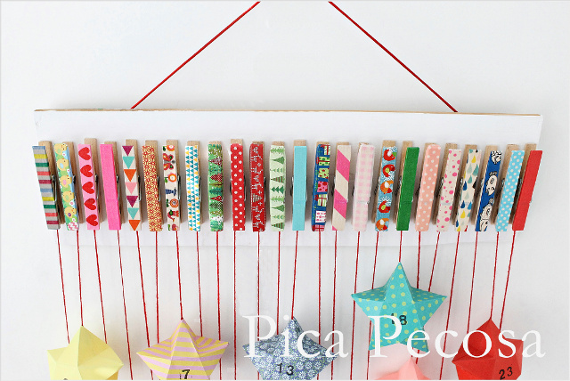 calendario-adviento-diy-trozo-madera-pinzas-ropa-adornadas-washi-tape-cajas-papel-forma-estrella