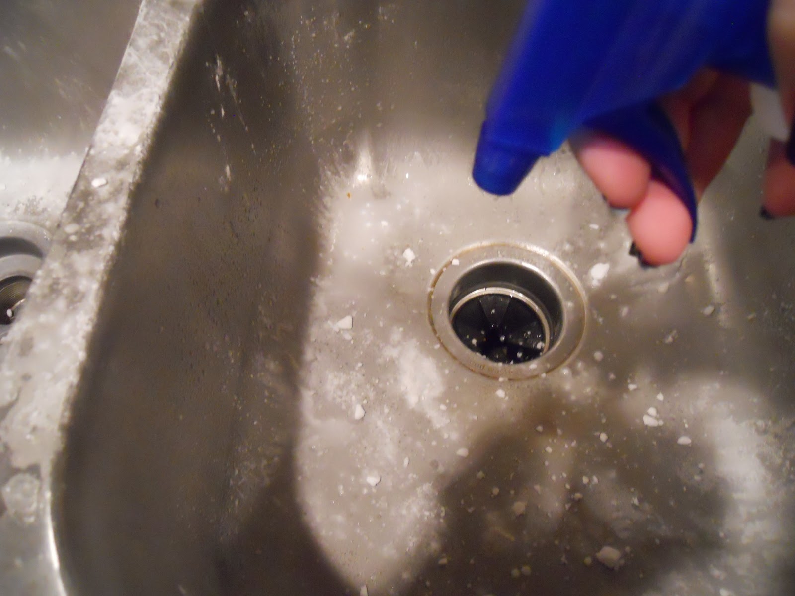 At Home Heroine Cleaning the Kitchen Sink Without Chemicals