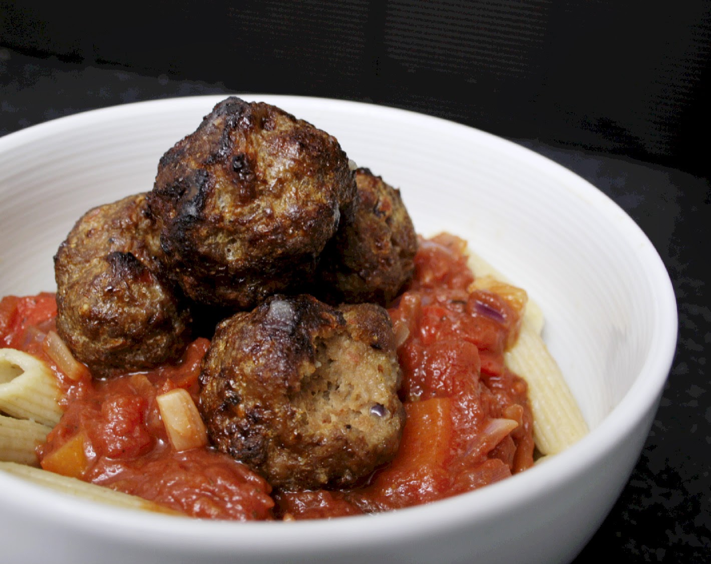 Bake meatballs to make them a little healthier.  You can make a large batch and then freeze them for easy dinners!