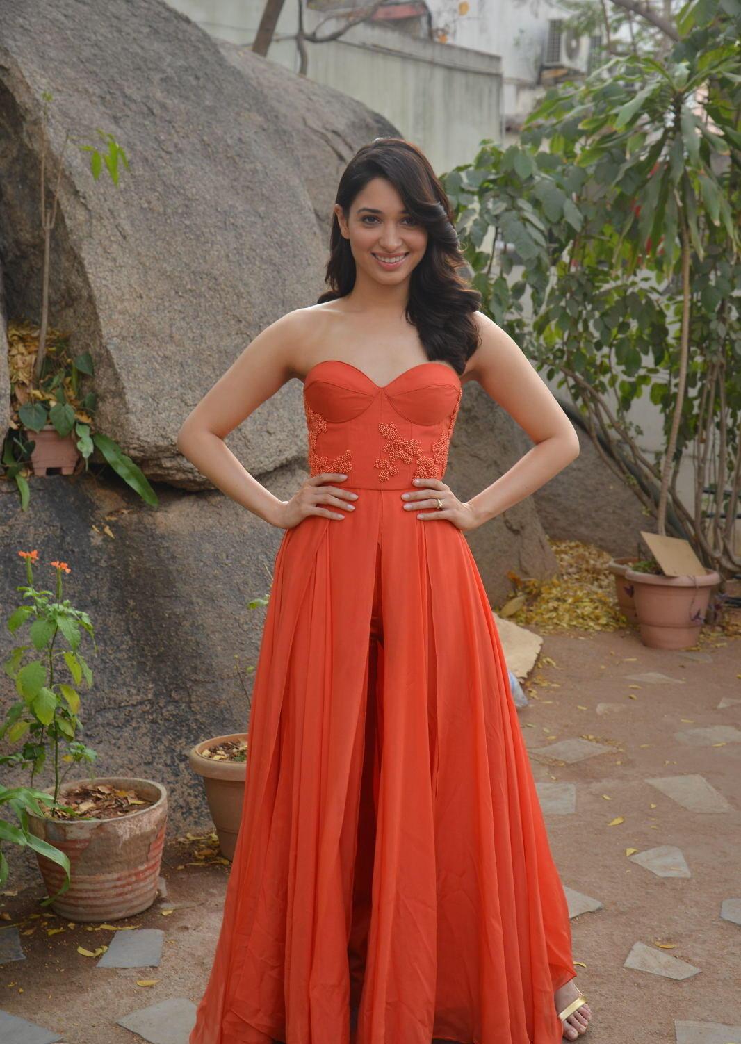 Tamannaah Bhatia Looks Super Sexy In A Orange Strapless Dress At Telugu