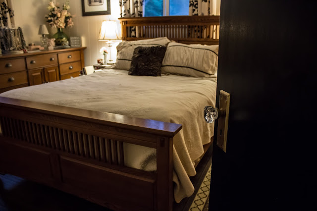 Finished painting the doors black Black door with glass knob to the bedroom