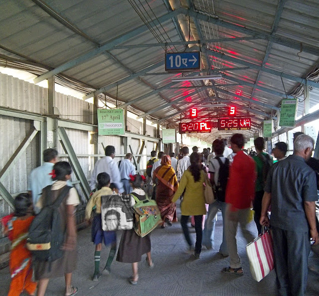railway bridge with commuters