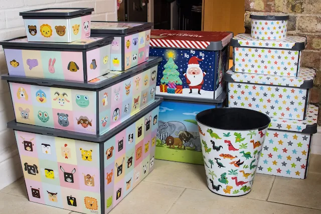 A range of different size plastic storage boxes for children