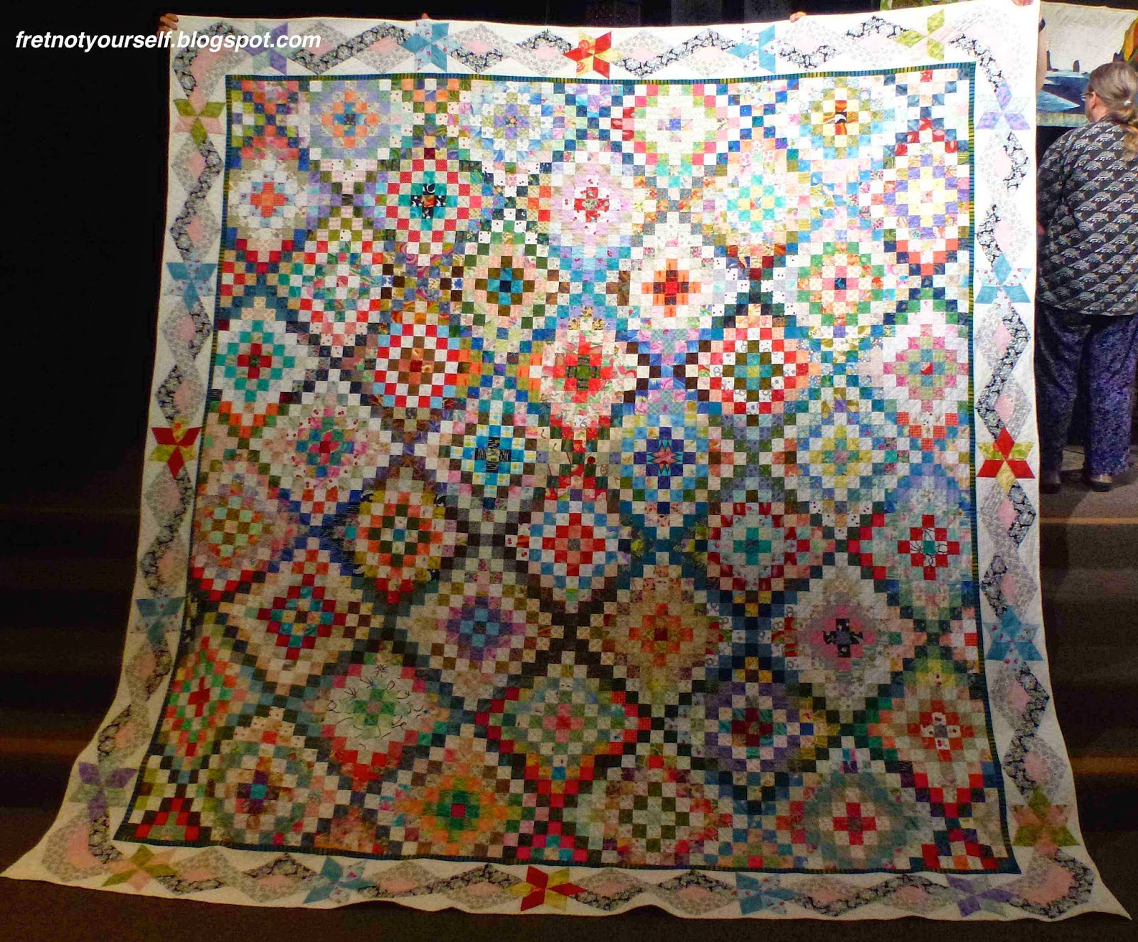 Trip Around the Blocks, a two-block variation of Mini Trips Around the World Bright colors liven this two-block quilt. One block is a Mini Trip and the alternate is an X-block.