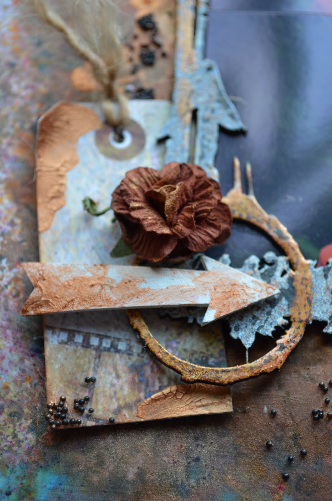 Captured - Grungy Mixed Media by Carrie Williams - Dearzae.com Grungy industrial mixed media layout in copper and turquoise with tag banner, die cuts, stickers, chipboard frame, copper crackle paste, jute, microbeads, and flowers
