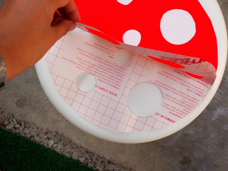 How to make a DIY toadstool stool:  Now attach the other half of the red contact paper