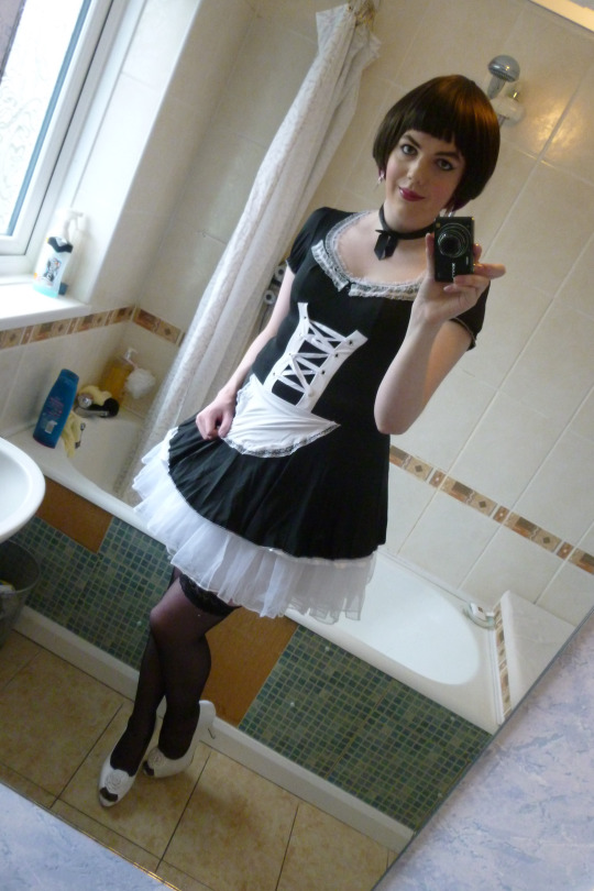 Crossdresser in maid outfit.