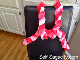 How to Make Fancy Paper Streamer Garland The finished look of pink and red paper garland
