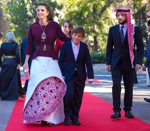 King Abdullah, Queen Rania, Crown Prince Al Hussein, Princess Salma, Prince Hashem attend a ceremony held in Amman for kingdom's 70th Independence Day. Queen Rania dress style, fashions, Valentino dress, Gant dress