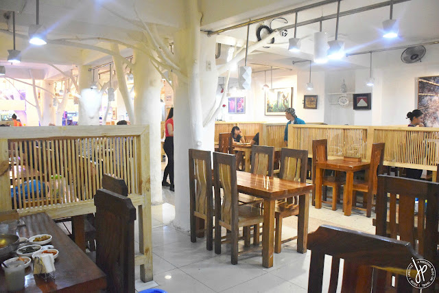 wooden tables and chairs in restaurant