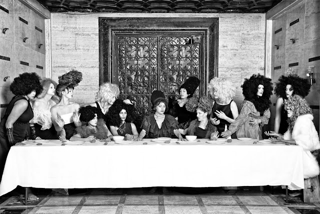 “Her Last Supper” from the series “Her” by Marjorie Salvaterra (2014) Is a photographic reinterpretation of the "Last Supper" with woman in similar poses are the men in that painting. Their, makeup, and costumes are very flamboyant and the image was set inside a mausoleum, with a large door pull providing a halo around the head of the central figure.