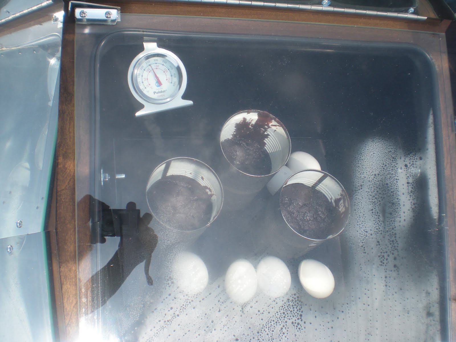 Gotta Wanna Needa Getta Prepared Solar Oven Eggs, and cake in cans