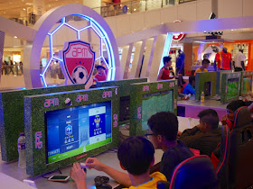 playing soccer video game at apm Hong Kong