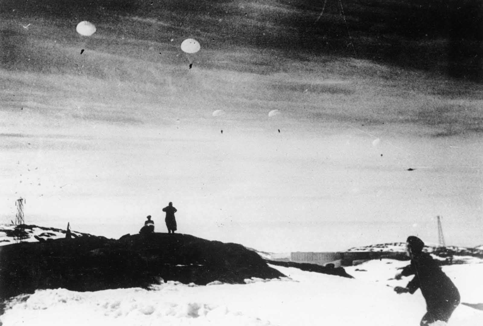 Waves of German paratroopers land on snow-covered rock ledges in the Norwegian port and city of Narvik, during the German invasion of the Scandinavian country.