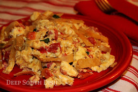 Eggs, scrambled with hot peppers and tomatoes, and tossed with crispy fried tortilla strips, makes for a fine meal whether it be breakfast, lunch, or even breakfast for dinner.