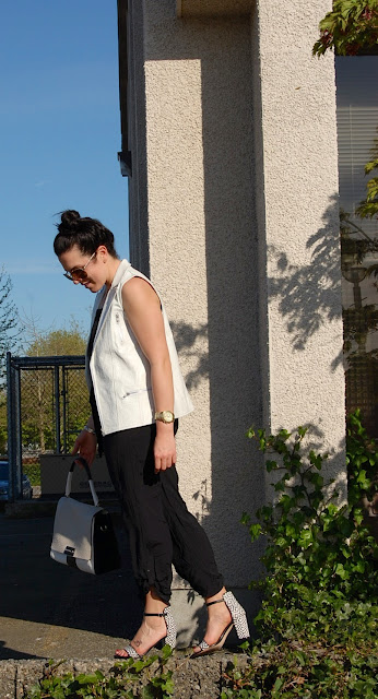 Stylestalker white leather vest, black jumpsuit and Zara sandals