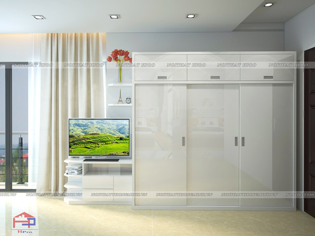Mẫu thiết kế tủ quần áo cửa lùa 3 buồng gỗ acrylic bóng gương. Gam màu trắng tinh tế kết hợp bề mặt sáng bóng như gương tạo nên một không gian rộng rãi và vô cùng thoáng đãng cho gia đình mau-tu-quan-ao-3-buong-cua-lua-2
