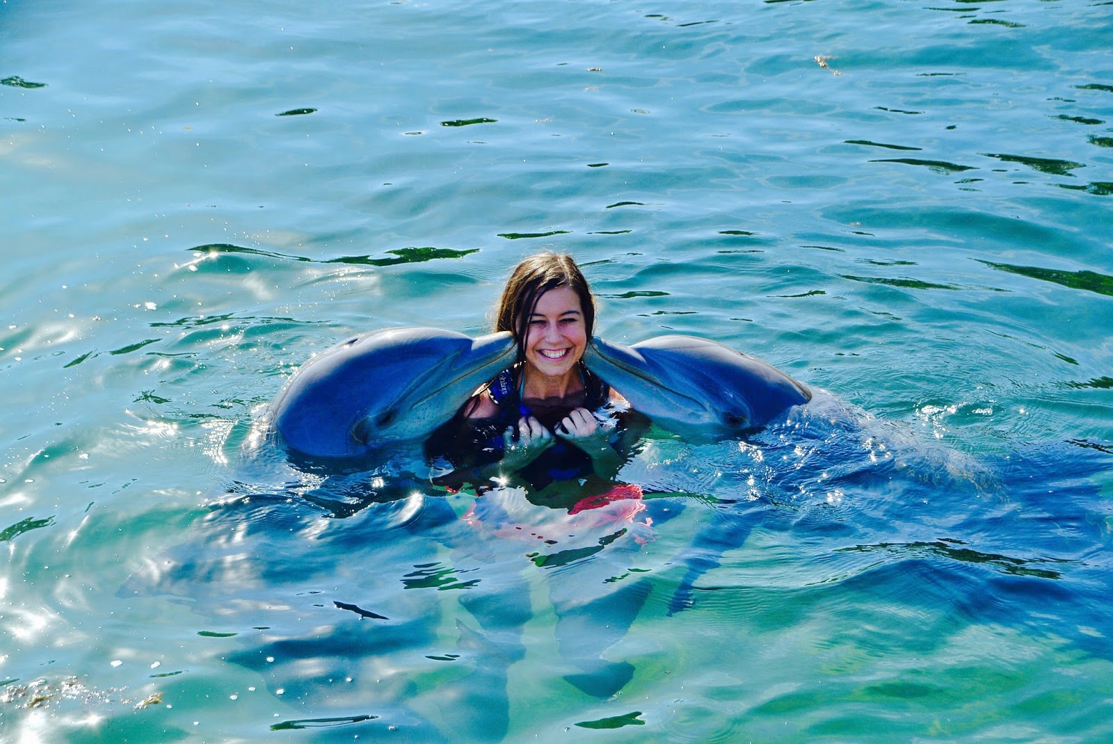 Love, Iris Swimming with Dolphins at Delphinus Riviera Maya