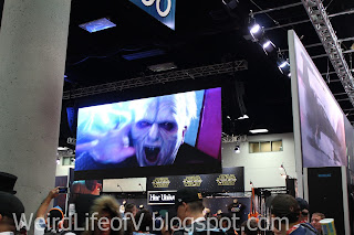 San Diego Comic-Con 2015 - Exhibition Floor Star Wars films being shown on screens above the Star Wars booth