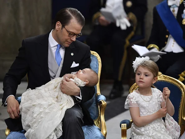 Queen Silvia and King Carl Gustaf of Sweden, Crown Princess Victoria, Prince Daniel, Princess Estelle, Princess Madeleine of Sweden with daughter Princess Leonore and Christopher O'Neill, Prince Carl Philip and Princess Sofia, Prince Haakon and Princess Mette-Marit of Norway, Crown princess Mary and Prince Frederik of Denmark, Ewa and Olle Westling at the christening of Prince Oscar of Sweden at the Royal Chapel in Stockholm.Antonio Berardi Blue Cape-back Stretch Crepe Dress