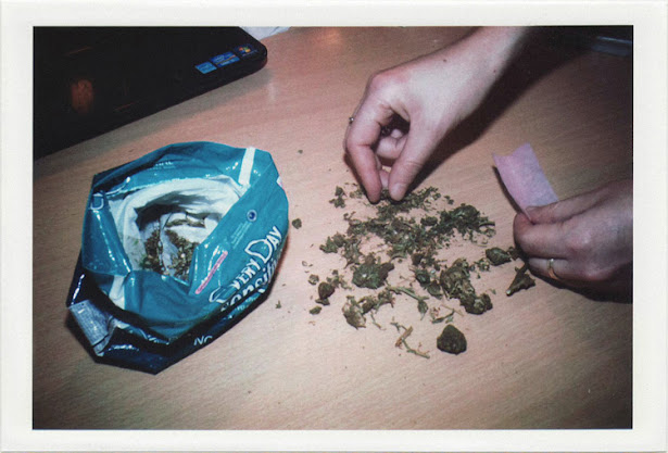 dirty photos - fumus - a photo of girl rolling marijuana