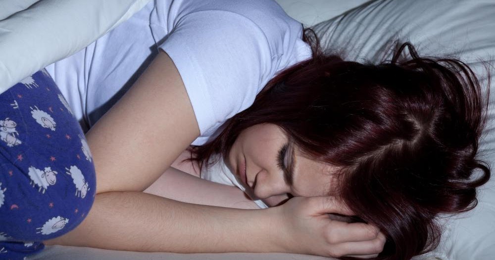 Women in love sleeping with lesbian rainbow flat stock photo