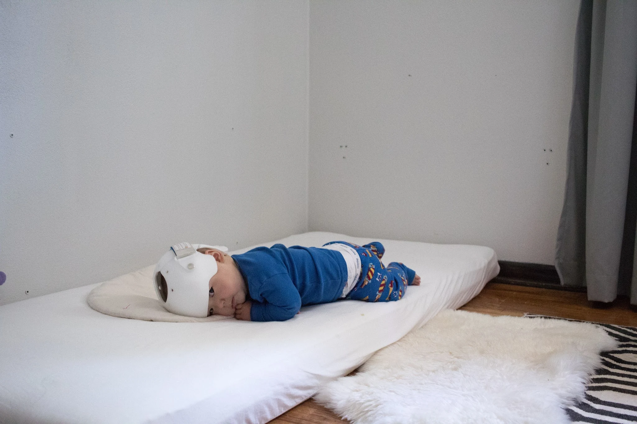 Using a Montessori floor bed for your baby from birth is very different from a crib. Here are some of the realities of using a floor bed from birth.