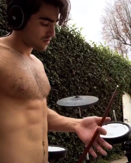 Blake Michael shirtless on his IG story playing drums.