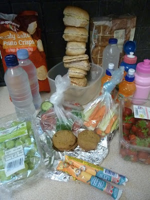 Picture of all the sandwiches, snacks, water, crisps, fruit, buns and yogurts we took on our trip to Legoland on a budget