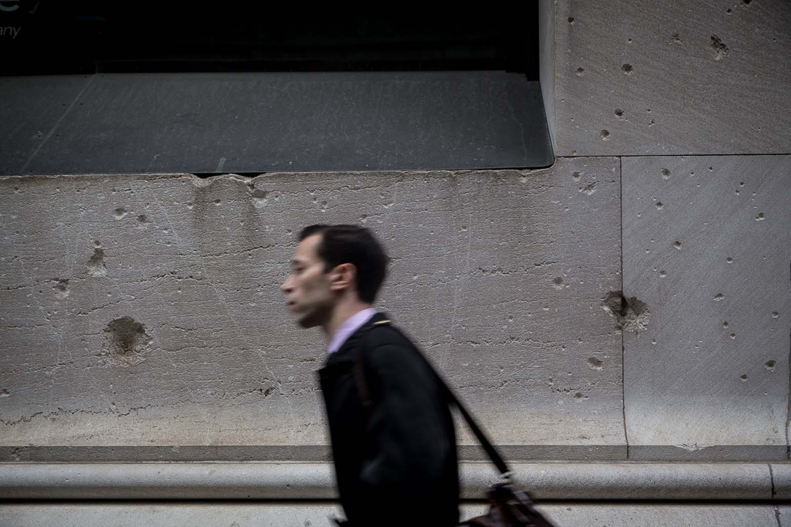 Shrapnel craters from the explosion still scar the facade of 23 Wall Street today.