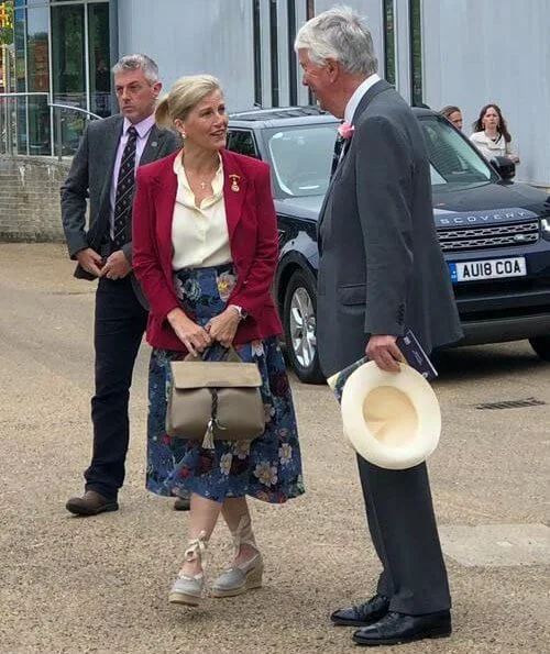 Countess of Wessex wore a floral-print crepe midi skirt by Erdem, Alexander McQueen slim fit blazer, pearl earrings