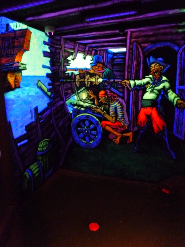 Inside the pirate ship at Pirate Island Adventure Golf course at Hoebridge Golf Centre in Woking is a blacklit hole! Pirate Island Adventure Golf course at Hoebridge Golf Centre in Woking, Surrey
