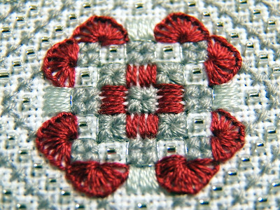 Close-up of center motif - squares edged with buttonhole stitching