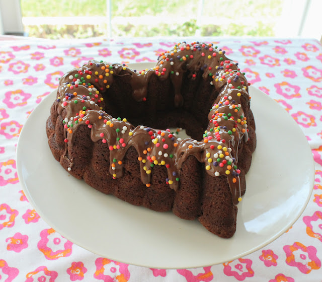 Nutella Bundt with Nutella Glaze #BundtBakers  Fudgy and soft with a subtle nuttiness, this Nutella Bundt cake with Amaretto and ground almonds, topped with slightly warmed Nutella, is a brownie-like confection that every chocolate or Nutella fan will love.