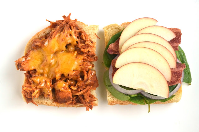 Slow-Cooker Apple Barbecue Chicken Sandwiches are loaded with slow-cooked shredded chicken with homemade BBQ sauce, thinly sliced apples, melted cheddar cheese, red onion, bacon and spinach all on top of toasted sourdough bread! www.nutritionistreviews.com