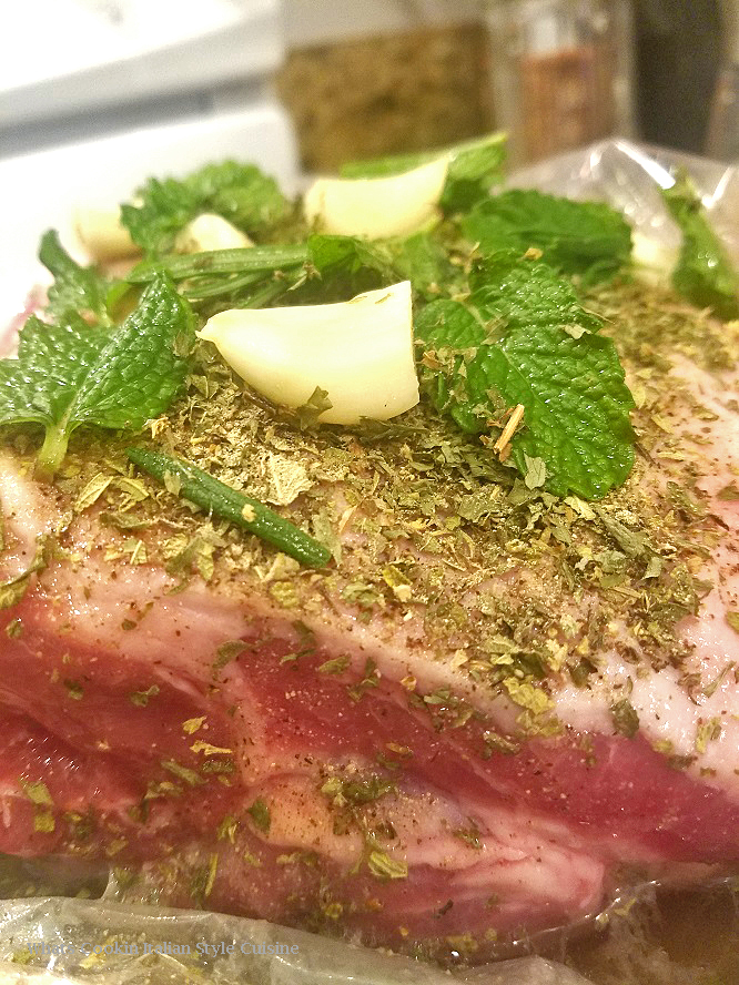 this is an herb crusted leg of lamb in a marinade