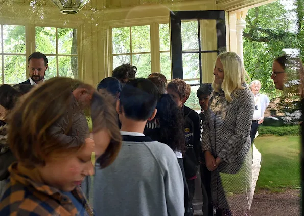 Haakon and visits the Summer Library at the Palace Park. Princess Mette Marit wore Valentino dress