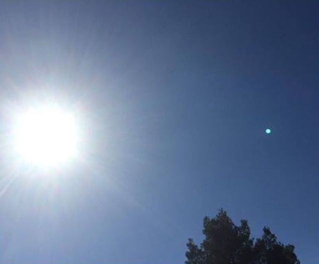 blue planet like object in the sky appears over arizona and spain