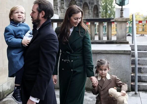 Prince Felix, Princess Claire and their children Princess Amalia and Prince Liam. Maria Teresa. Claire worn a green wool trench coat
